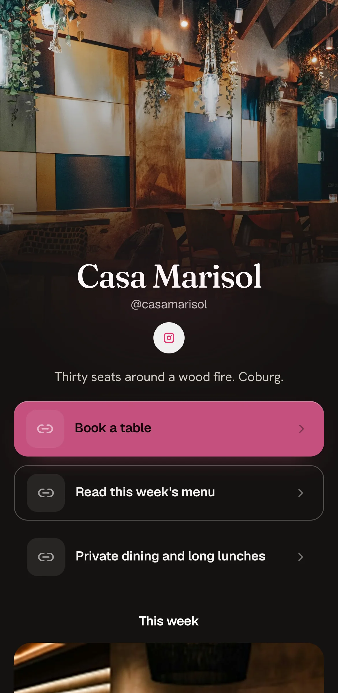 Example link in bio page for a fictional restaurant, Casa Marisol: dark dining room photo behind a serif name, pink Book a table button, menu below.